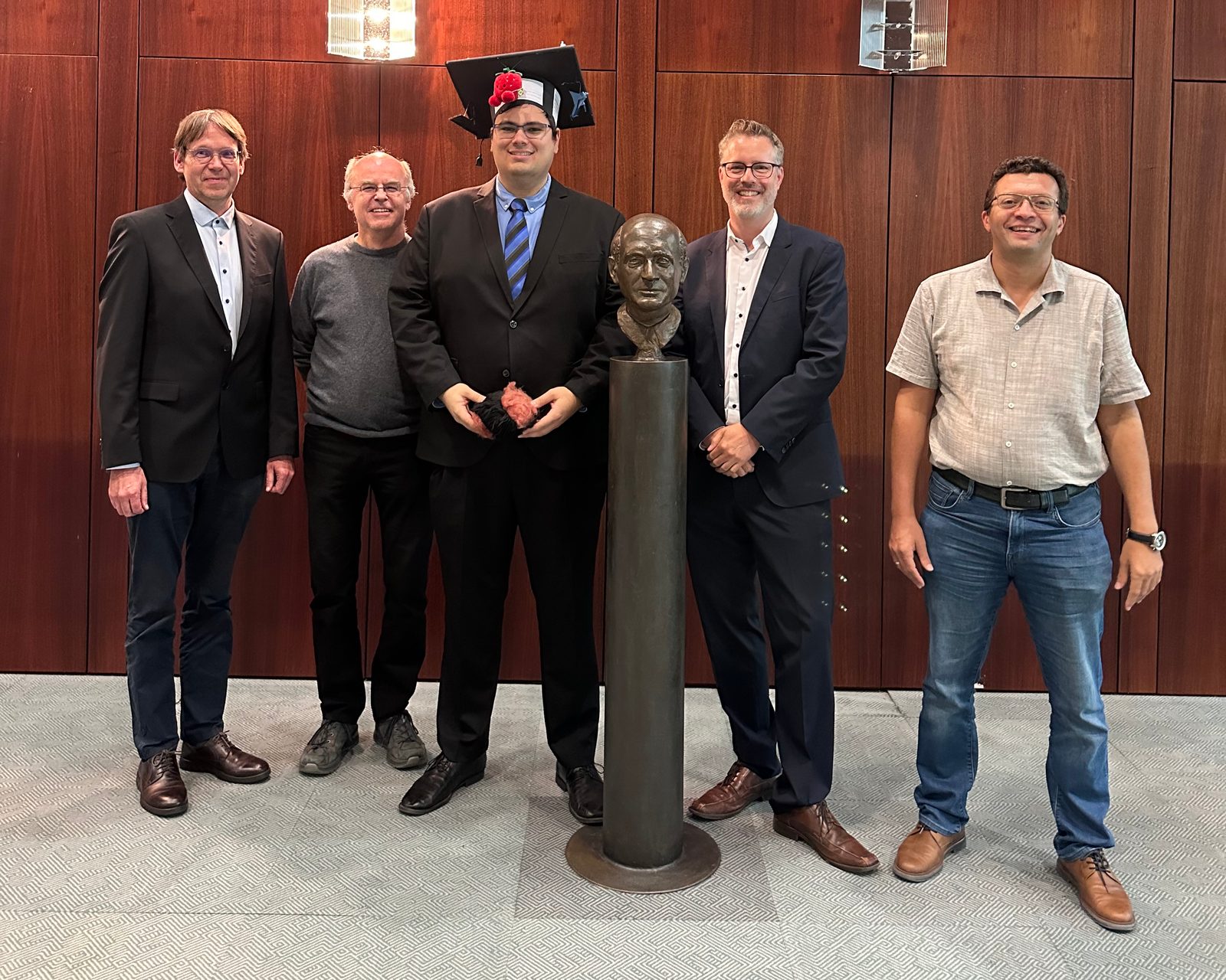 Michael Schlichtig with members of his doctoral committee after the successful defense at the Heinz Nixdorf Institute, Paderborn University.